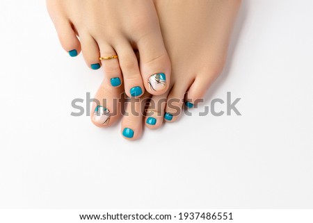 Manicure, pedicure beauty salon concept. Womans feet on white background