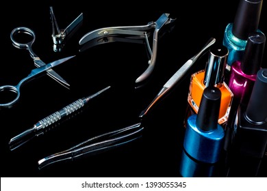 Manicure and pedicure tools on black background, isolated. Equipment for beauty shop, cosmetic salon or beauty parlour. Manicure tools in the beauty salon. Equipment for manicure or pedicure salon.