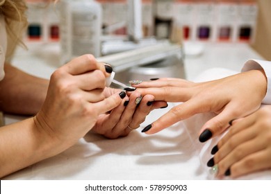 Manicure Process In Beauty Salon, Close Up. Black Nails.