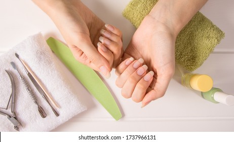 Manicure. Women's Hands On A Towel. Manicure Tools, Nail Polish. Home Nail Care, SPA, Beauty. Long Natural Nails. Beauty Salon.