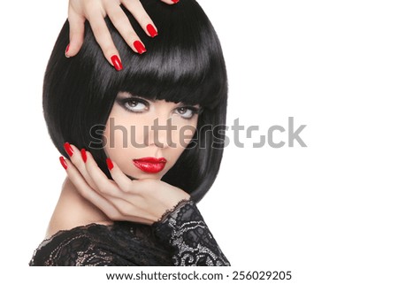 Manicured nails. Beauty girl portrait. Red lips. Back short bob hair. Hairstyle. Professional makeup.