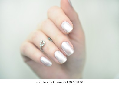 Manicured Nails With Pearlescent Nail Polish Isolated On White Background