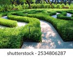 Manicured plants surrounded by a maze of paths taken on a Labyrinth at Sunnylands Botanical Gardens in Rancho Mirage, CA