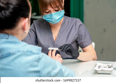 Manicurist Doing Manicure With Protective Mask.