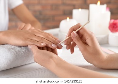 Manicurist Working With Client's Nails At Table, Closeup. Spa Treatment