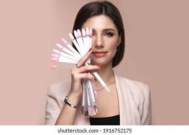 Manicurist In Working Form With Tools In Hand. Nail Photo Content.