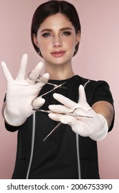 Manicurist In Working Form With Tools In Hand. Nail Photo Content