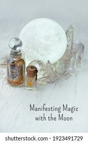 Manifesting Magic With The Moon. Spell Jars, Moon Lamp, Healing Quartz Minerals On Table. Moon Crystal Ritual, Modern Magic, Esoteric Spiritual Witchcraft Practice. 