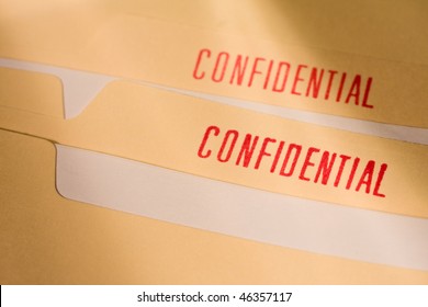 Manila Folder With Confidential Stamps In Red.