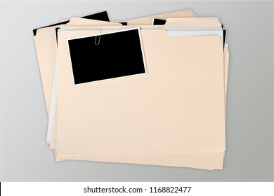 Manila Folder With Some Documents In It. On Background