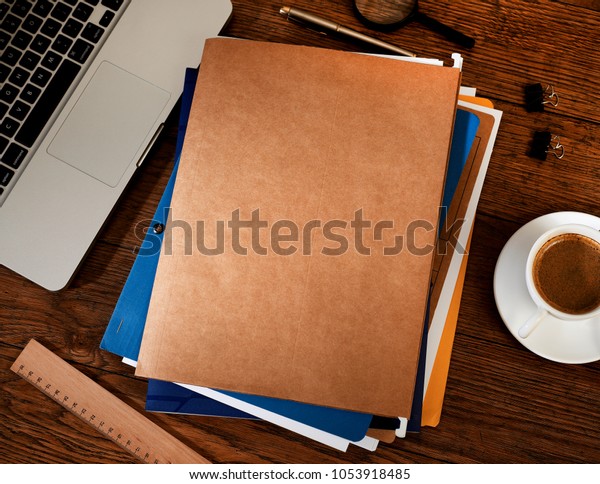 Manila folders on\
desk