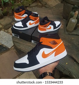 Manila, Ph - Oct 2019, Jordan 1 Mid Starfish. Famous For Its Resemblance To The Shattered Backboard, The Touch Of Orange, Black And White Gives The Hype For The Sneakerhead. Must Cop Sneaker The Year