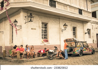 MANILA, PHILIPPINES - 29 JANUARY, 2014: everyday street life in the district of Intramuros, which was the seat of the government when the Philippines were a component of the Spanish Empire.