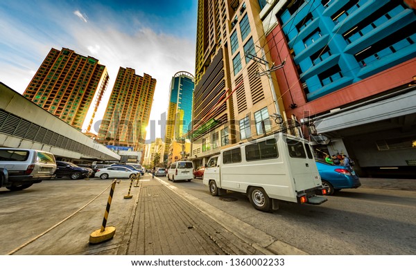 MANILA, PHILIPPINES -
CIRCA MARCH 2018: View on daily life on the streets of the city as
cars and pedestrians pass by during the day circa March, 2018 in
Manila, Philippines.