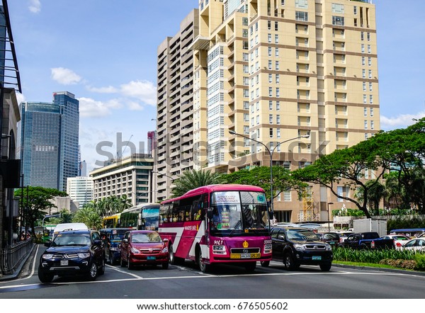 Manila,\
Philippines - Dec 21, 2015. Cars stopping on Alaya Street at\
downtown in Manila, Philippines. Manila is a major center for\
commerce, banking and finance in\
Philippines.