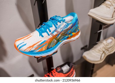 Manila, Philippines - Feb 2022: Asics Running Shoes For Display On A Wall Rack At A Local Boutique Store.