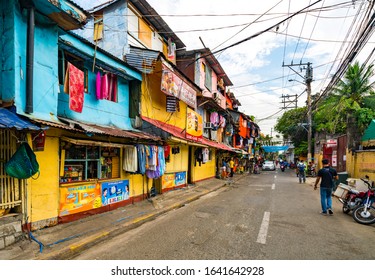 Manila, Philippines - January 6, 2020: People in old town of Manila, capital city of Philippines.