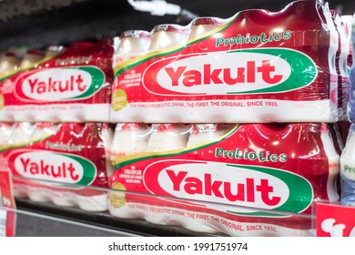 Manila, Philippines - June 2021: Yakult Is A Japanese Sweetened Probiotic Milk Beverage Fermented With The Bacteria Strain Lactobacillus Paracasei Shirota. For Sale At A Supermarket.