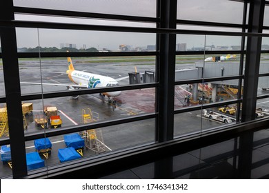 Manila, Philippines - May, 25, 2020: A Single Lonely Plane From Airport Window.  Airline Crisis During Covid Coronavirus Pandemic Concept