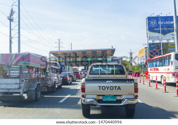 Manila,\
Philippines - May 26, 2019: street view of car pass by highway toll\
in Manila Highway in Manila,\
Philippines.