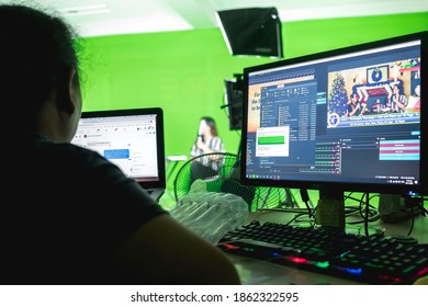 Manila, Philippines - Nov 2020: Behind The Scenes Of A Live Broadcast. An Editor Monitors The Live Feed On A Monitor.