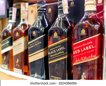 Manila, Philippines - Sept 2020: Popular variants of Johnnie Walker Scotch Whiskey at an aisle of a liquor store or supermarket.