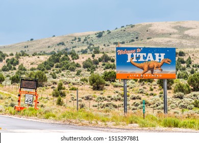 Manila, USA - July 24, 2019: Sign closeup for welcome to Utah near Flaming Gorge National Recreational Area Park with dinosaur image on road highway