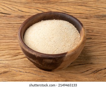 Manioc Flour In A Bowl Over Wooden Table.