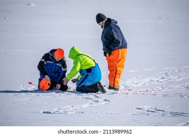 Manitowoc, WI USA January 25 2022: The fishermen during ice fishing on the lake Michigan 