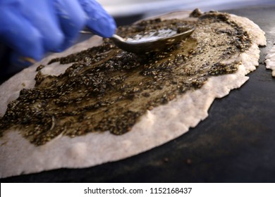 Mankousheh, A Lebanese Flatbread Made With Thyme, Oil, Spices And Cheese Seen On A Saj Oven