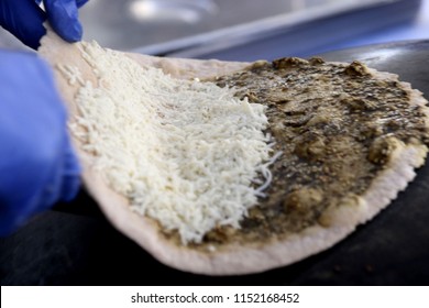 Mankousheh, A Lebanese Flatbread Made With Thyme, Oil, Spices And Cheese Seen On A Saj Oven