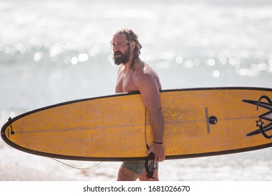 MANLY, NSW/AUSTRALIA – MARCH 2020: Young Adults Catching Waves Surfing At Manly Beach On A Bright Warm Sunny Day On Clear Blue Water