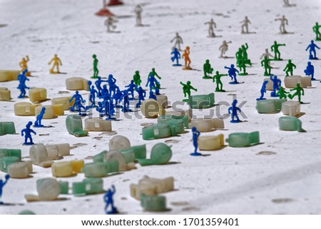 Man-made plastic manlike figures practising sports. Sports whistles made from plastic.