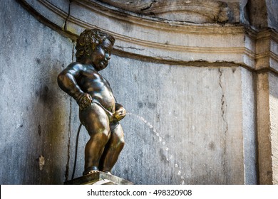 Manneken Pis (Little Man Pee) Or Le Petit Julien, A Landmark Small Bronze Sculpture In Brussels, Belgium