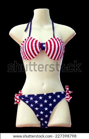 Mannequin bikini in USA flag pattern.Black background.