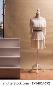 Mannequin with cream colored dress