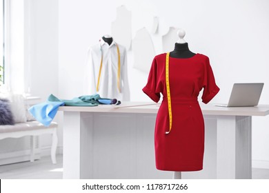 Mannequin With Dress And Measuring Tape In Tailor Studio