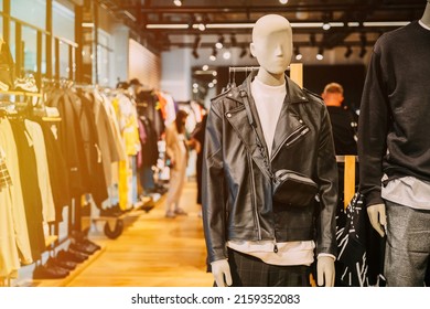 Mannequin Dressed In black leather Men male Casual Clothes And jacket In Store Of Shopping Center. Stack clothes In Store Of Shopping Center. shelf display in shop mall store. Store Of Shopping Center