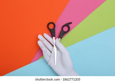 Mannequin Hand Holding Hair Scissors On Colorful Background. Minimalism Beauty Concept. Top  View