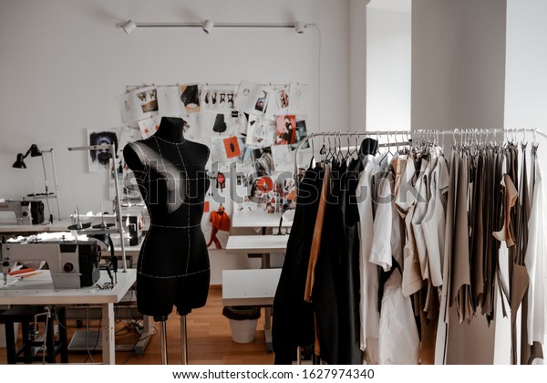 Mannequin and hangers with development\
materials. Design, studio for sewing and cutting clothes, designer\
clothes, manufacturing, craft\
product.