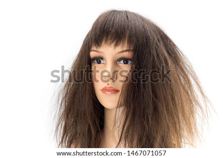 Mannequin woman head fake with damaged  hair wig on white background.