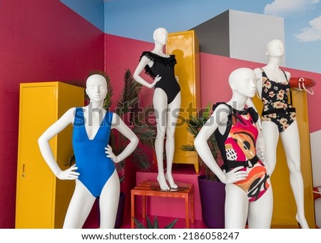 Mannequins in colorful swimsuits in clothes shop. Summer vacation. Fashion model. Colorful vacation concept