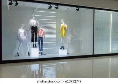 Mannequins With Dress In Fashion Store Display Window 