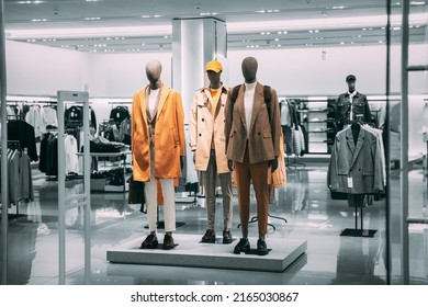 Mannequins Dressed In Men male Casual Clothes And coat jackets Clothes In Store Of Shopping Center. Stack clothes In Store Of Shopping Center. shelf display in shop mall store. Store Of Shopping