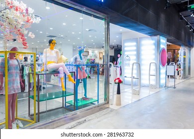 mannequins in fashion shop display window