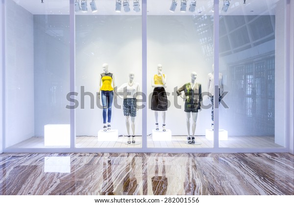 mannequins in fashion shop\
display window