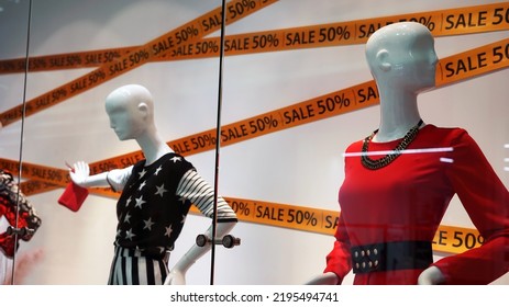 Mannequins In The Window Of A Fashion Store During A Discount Sale. Sales, Discounts. Selected Focus.