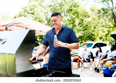 Manning The Grill At A Tailgate Party