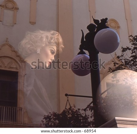 Manniquin reflected in window