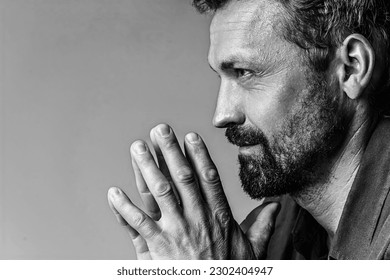 Man's brutal portrait in photo studio on white background in black and white colors. Handsome concept. High quality photo